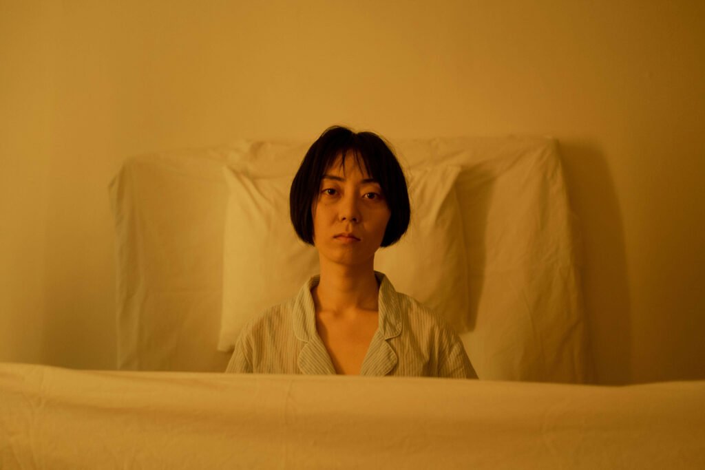 person waking up tired despite sufficient sleep — why am I always tired even after sleeping