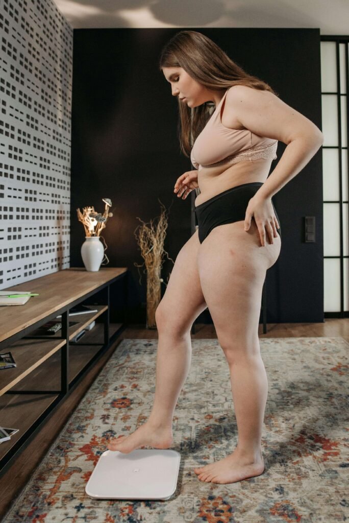 why am I not losing weight even after dieting frustrated woman scale