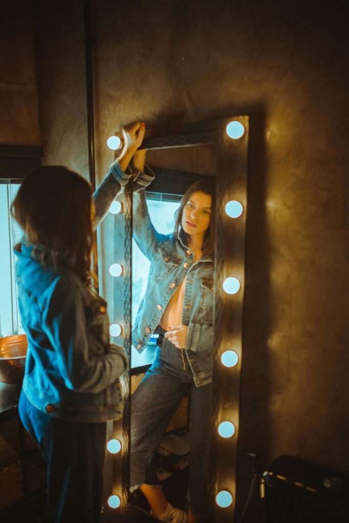 woman noticing sudden weight loss while looking in mirror